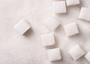 sugar cubes on sugar background